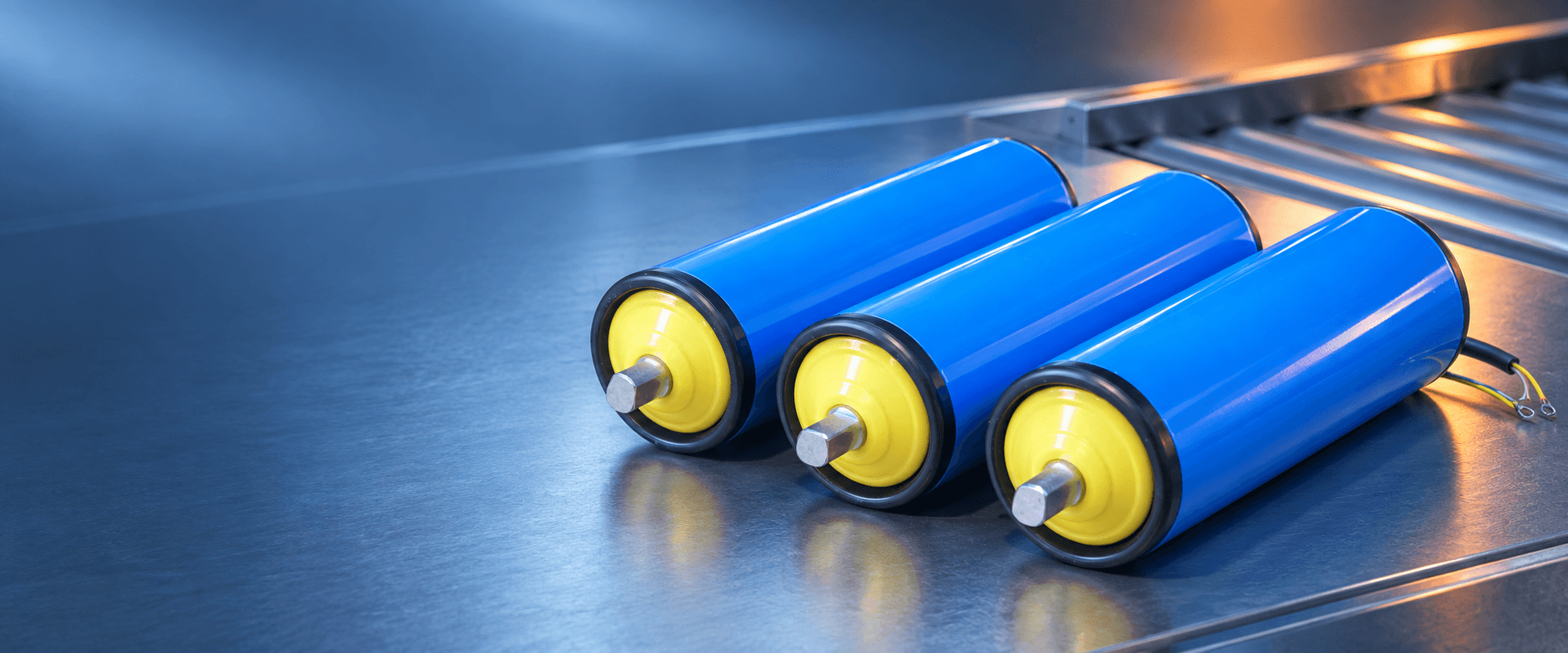 Three complete blue SHUANG SHUN electric drum motors with yellow end caps, shafts and power cable.